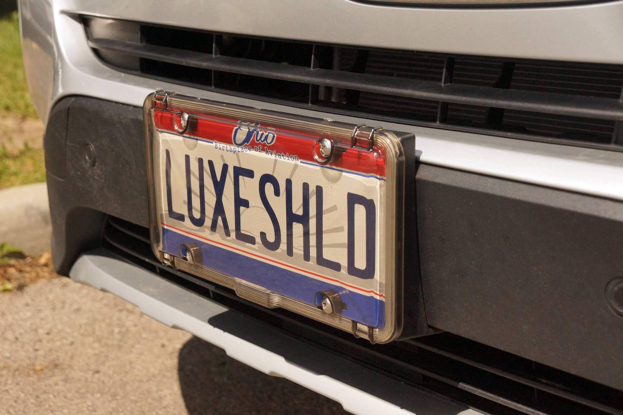 Luxe Shield, Premium License Plate Covers (2-Pack) incl Stainless Steel Screws | Durable and Weatherproof License Plate Protecto